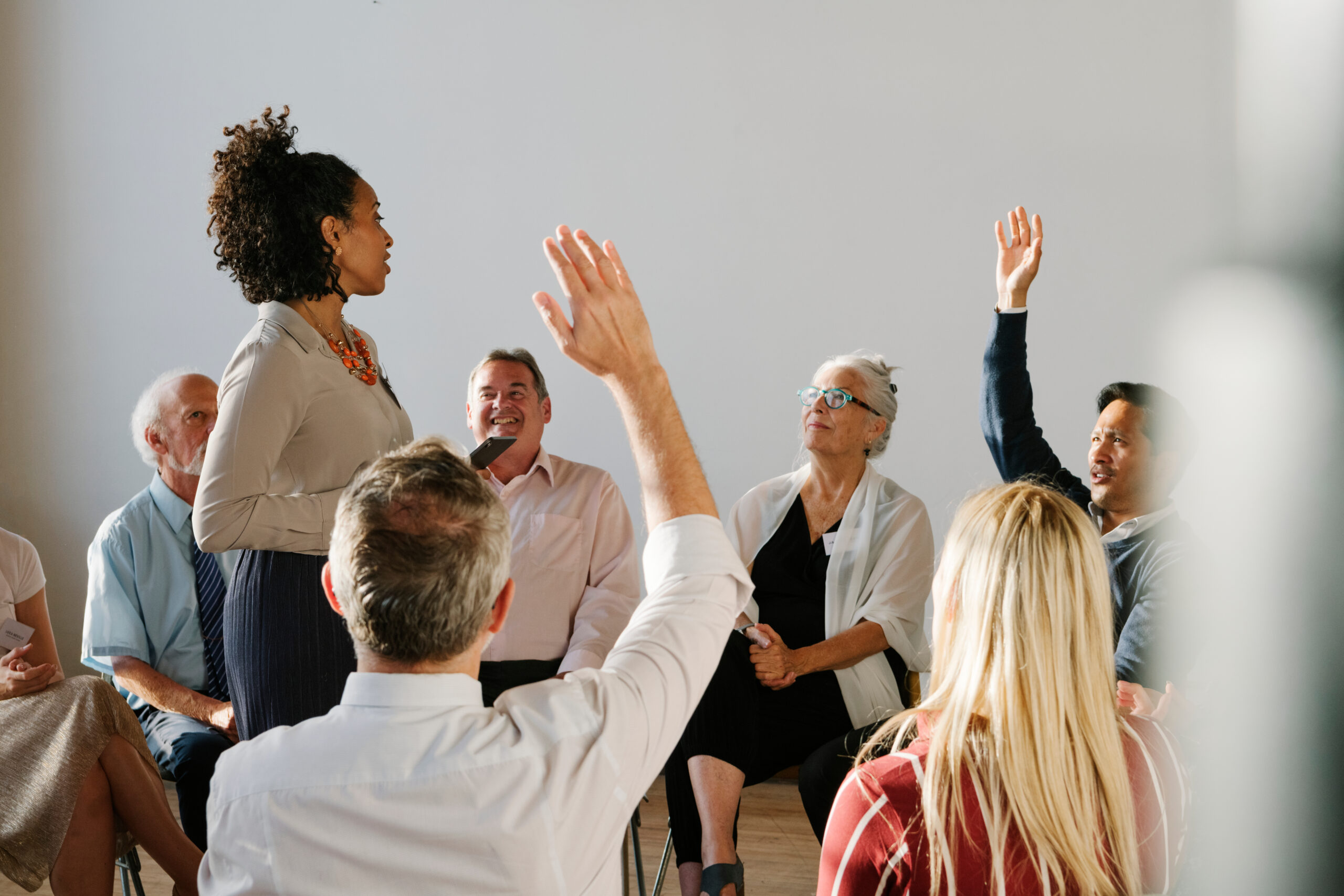 Young businesswoman talking to a crowd