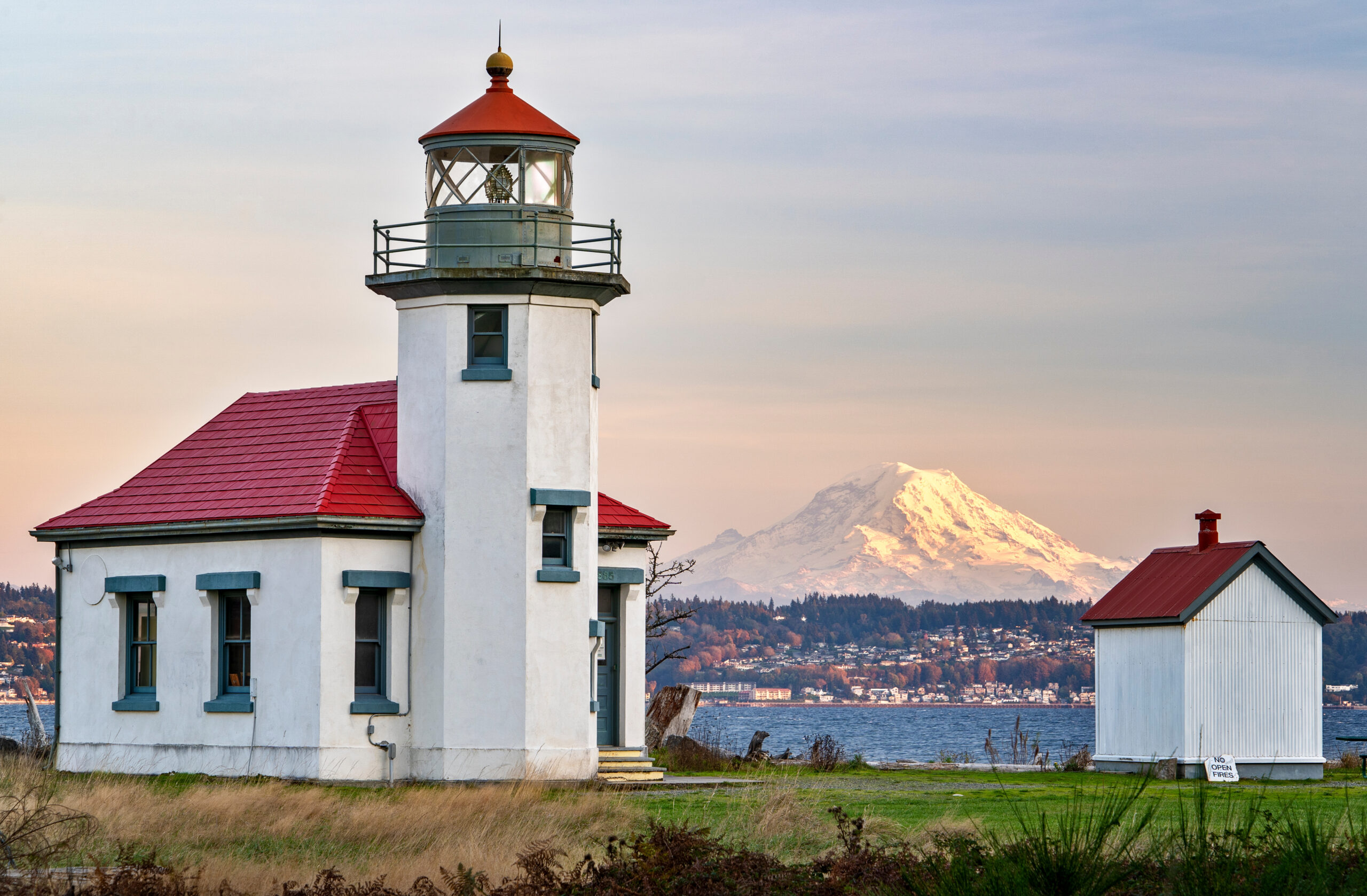 The Beautiful Point Robinson Lighthouse with Mount Rainier in the Backdrop during Sunset